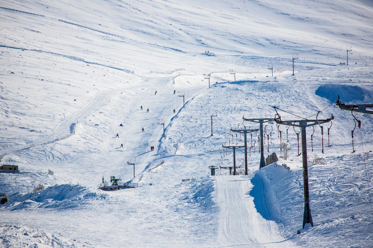 Ski lifts on Cairngorm Mountain with skiers at New Year