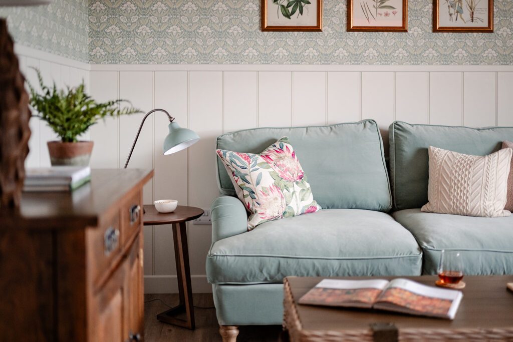 Blue sofa in the living room of Garradh Cottage